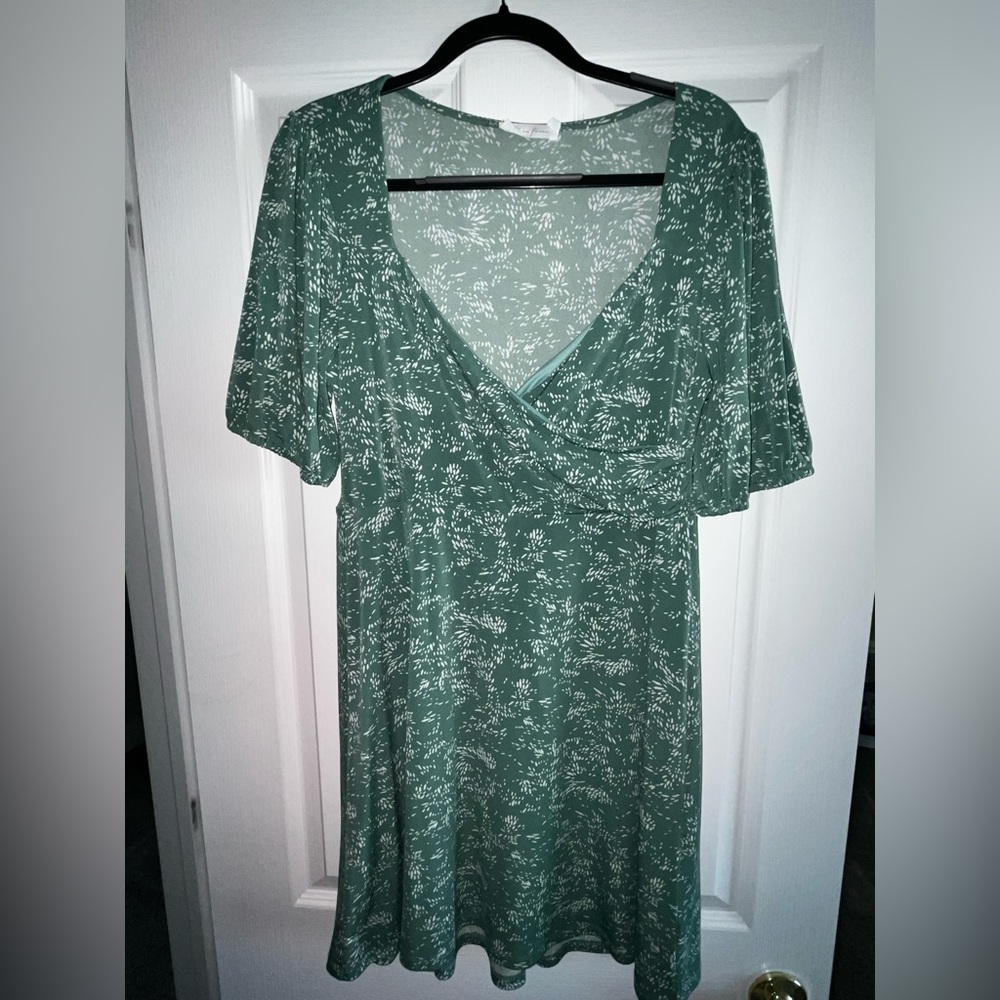 All in favor green dress with white flowers. Crisscross bodice.